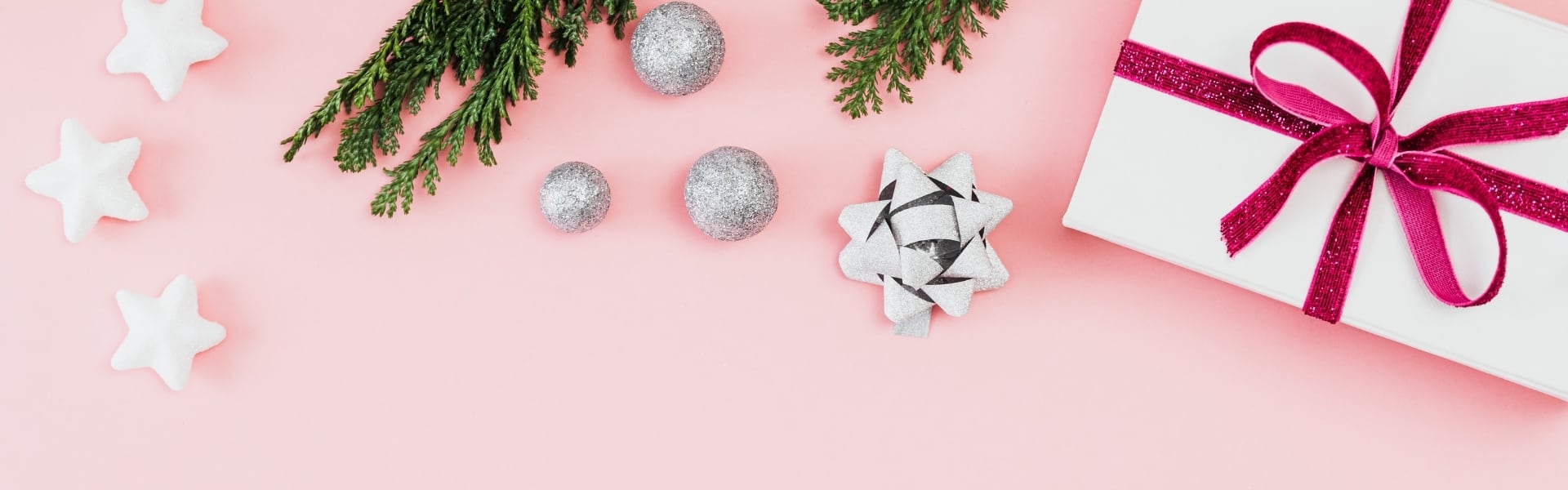Gifts and decorations on a pink background