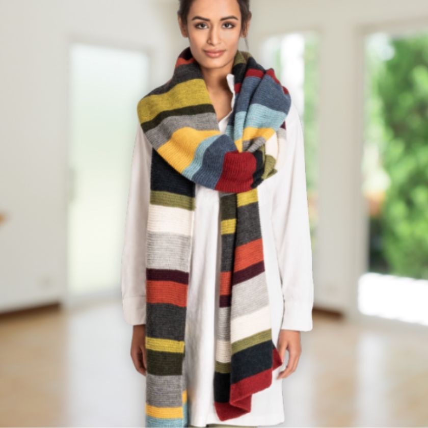 Model wears the 14 color Woolstok Light wrap from the Dizzy Knitter
