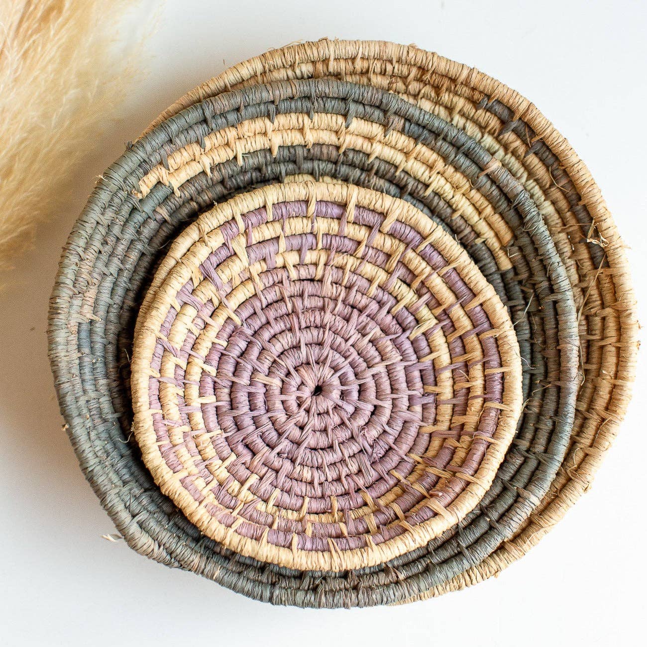 Stack of woven Autumn Baskets with concentric circles on a white background