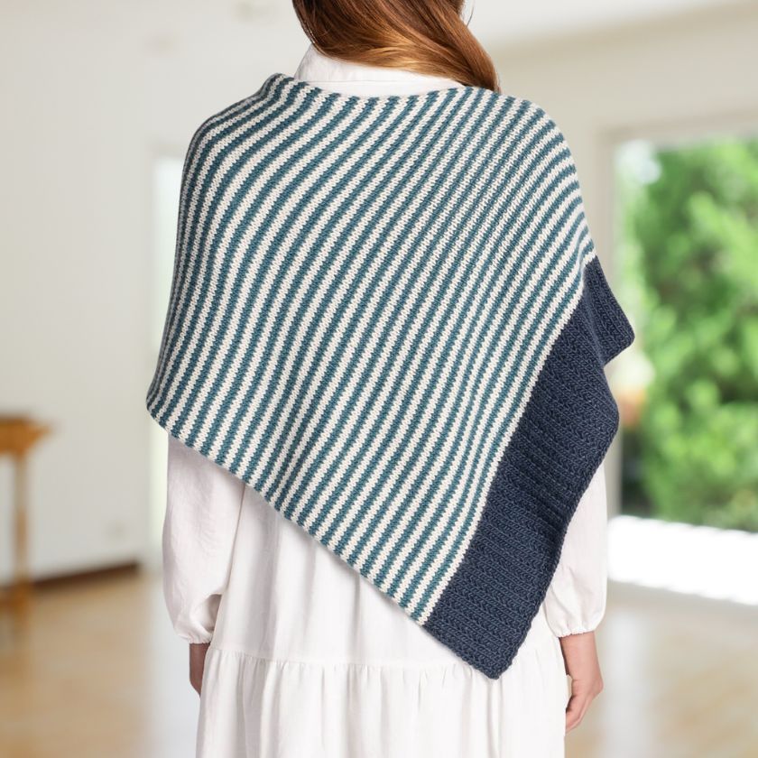 Woman showing off the back of a blue and white striped Bianca Wrap
