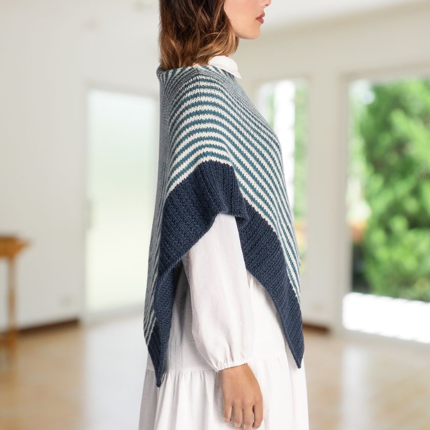 Woman wearing a blue and white striped Bianca Wrap in a room