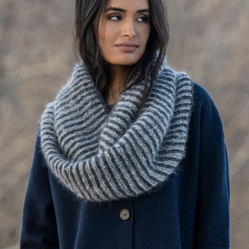 Model wearing the Castle Rock Cowl from the Dizzy Knitter