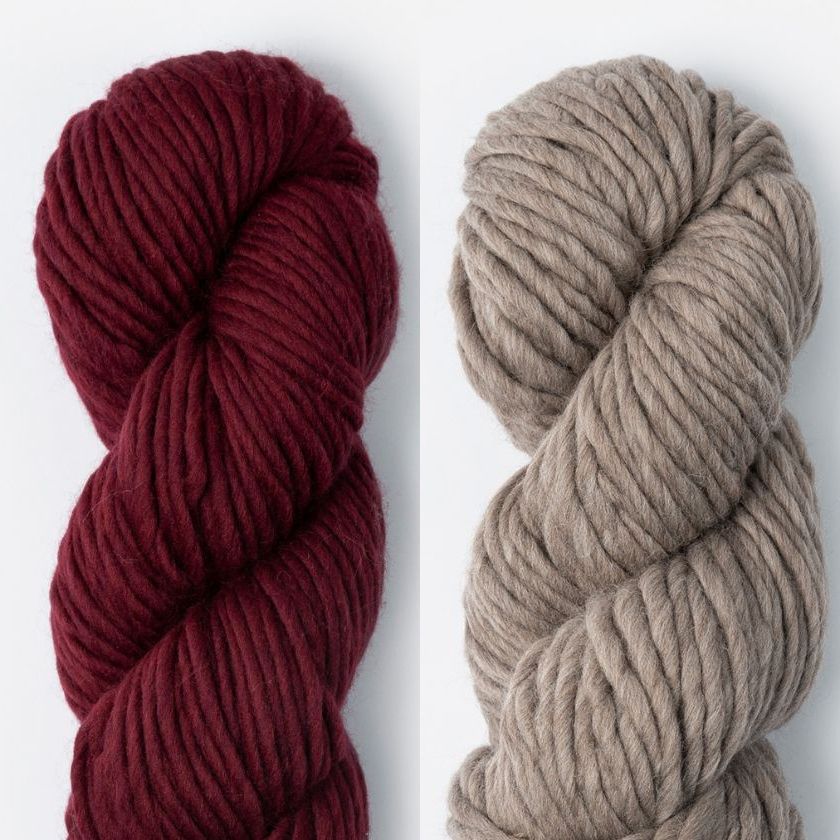 Two skeins of Woolstok North yarn in Cranberry Compote and Northern Lights
