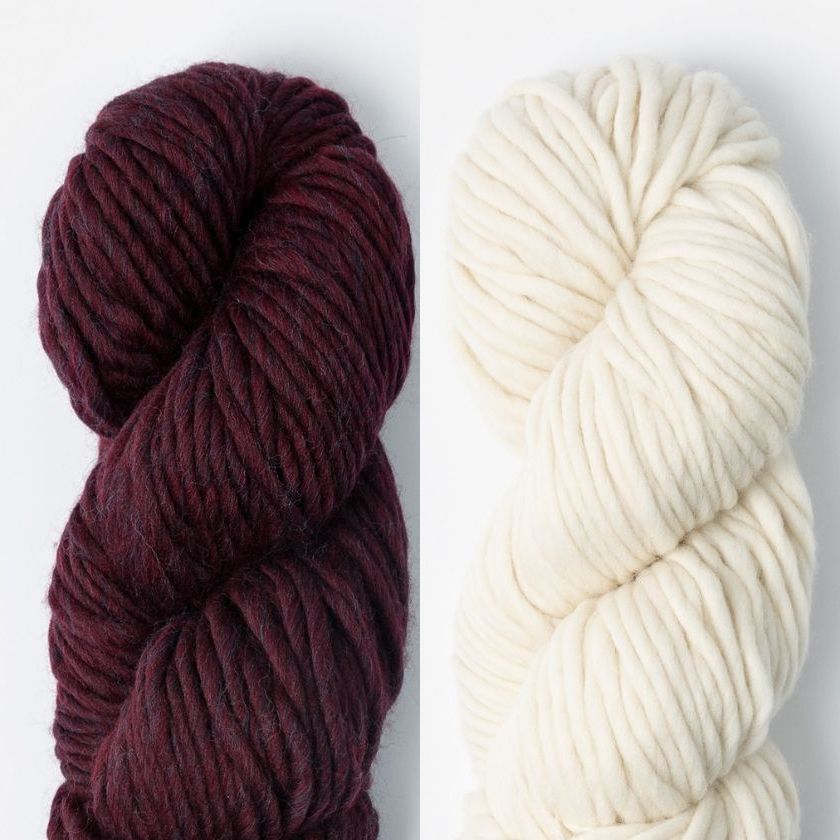 Two skeins of Woolstok North yarn in Deep Velvet and Highland Fleece