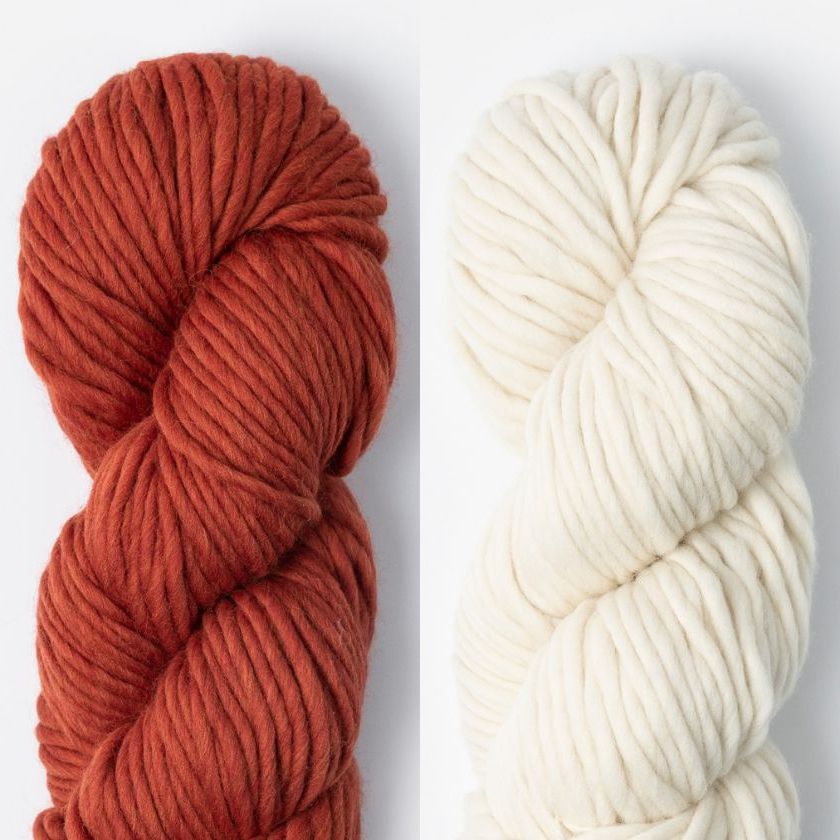 Two skeins of Woolstok North yarn in Rusted Roof and Highland Fleece