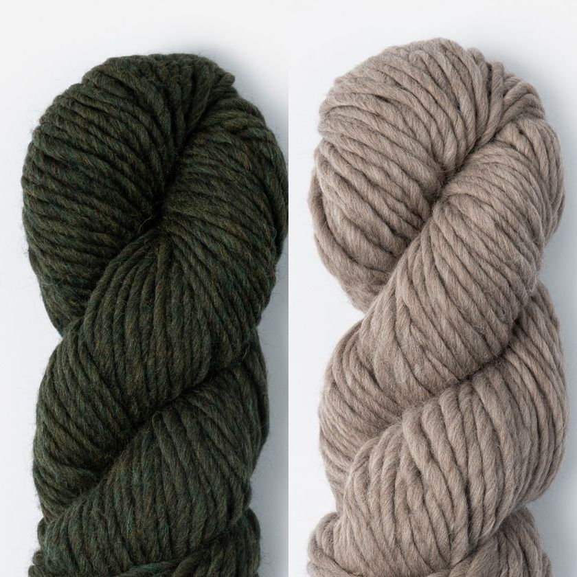 Two skeins of Woolstok North yarn in Wild Thume and Gravel Road
