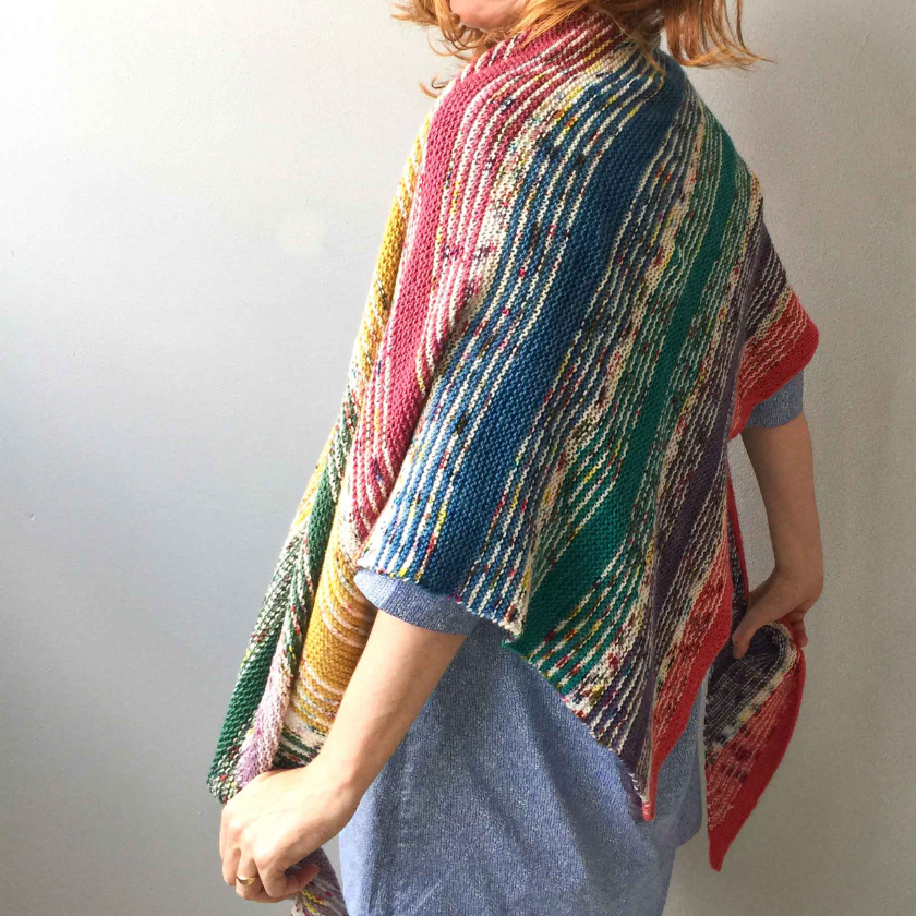 Model wearing the I've Got Sunshine Shawl from the Dizzy Knitter