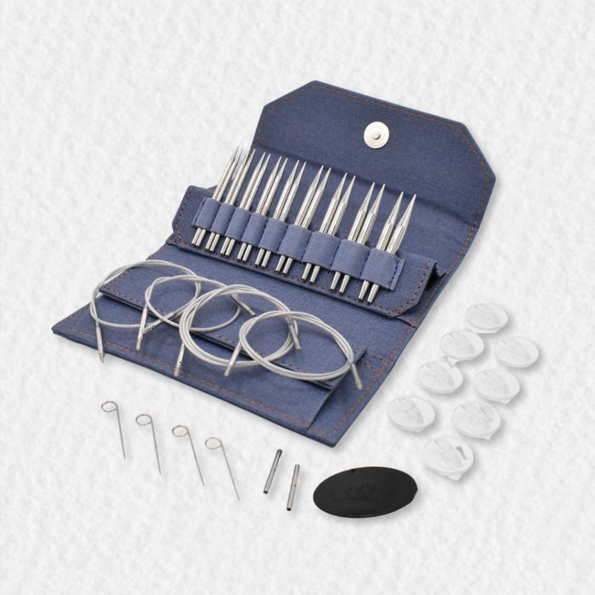 Set of Lykke Flight knitting needles in a denim blue case on a white background
