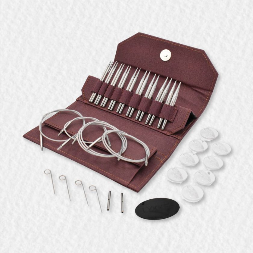Set of Lykke Flight knitting needles in a maroon case on a white background
