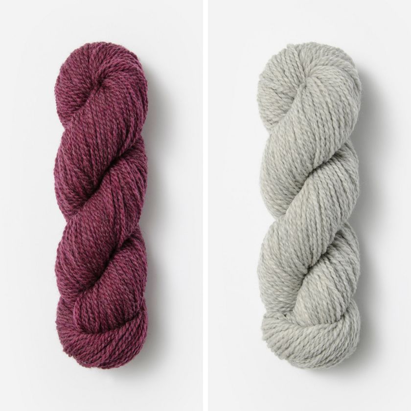 Two skeins of Woolstok Worsted yarn for the in the colors Pressed Grapes and Grey Harbor