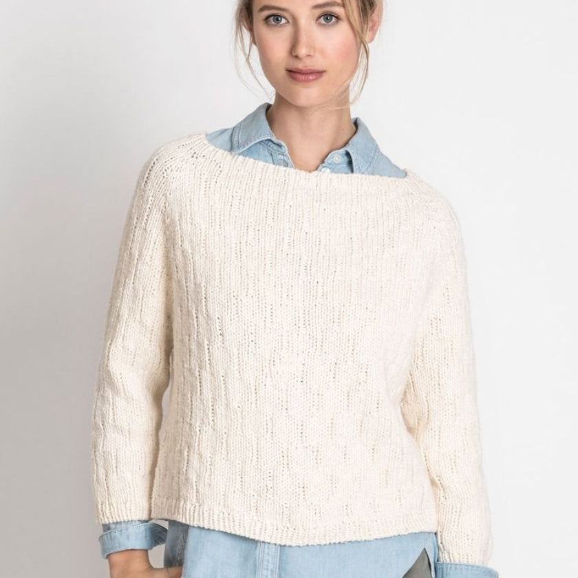 Model wears the Shady Hollow pullover from the Dizzy Knitter