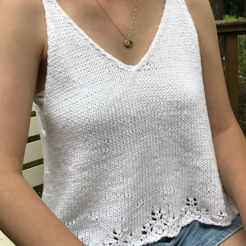 The Sydney Top knit tank shown in a lighter neutral color, worn by model
