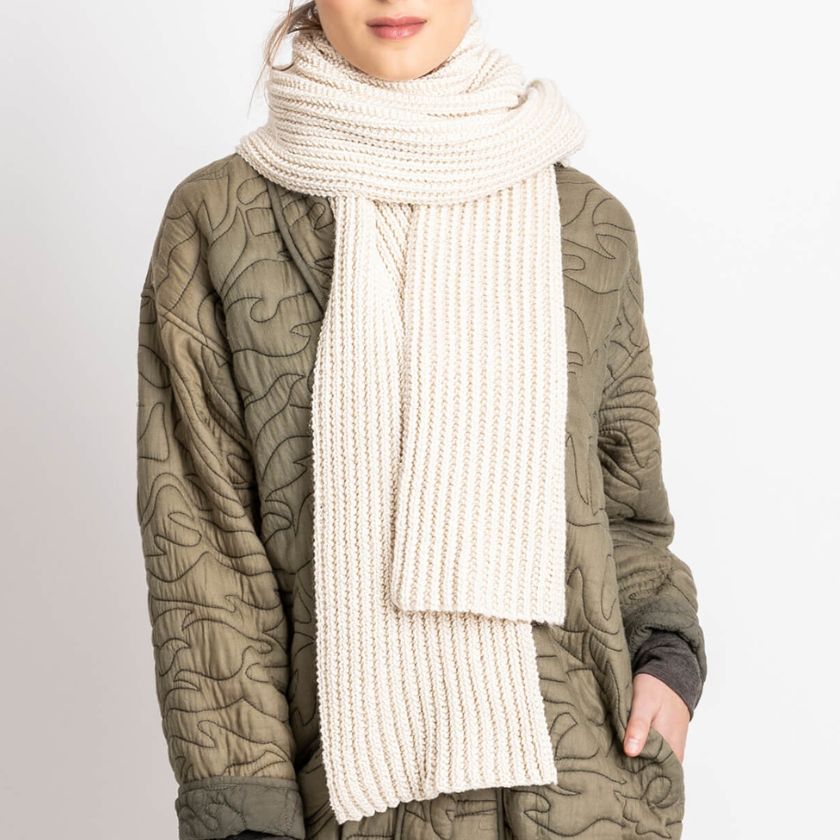 Model wearing the Winona Scarf from the Dizzy Knitter