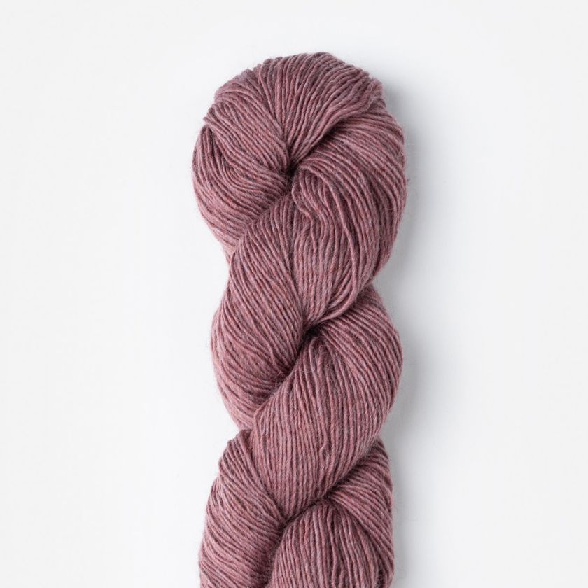 A skein of Woolstok Light yarn in Lilac Bloom