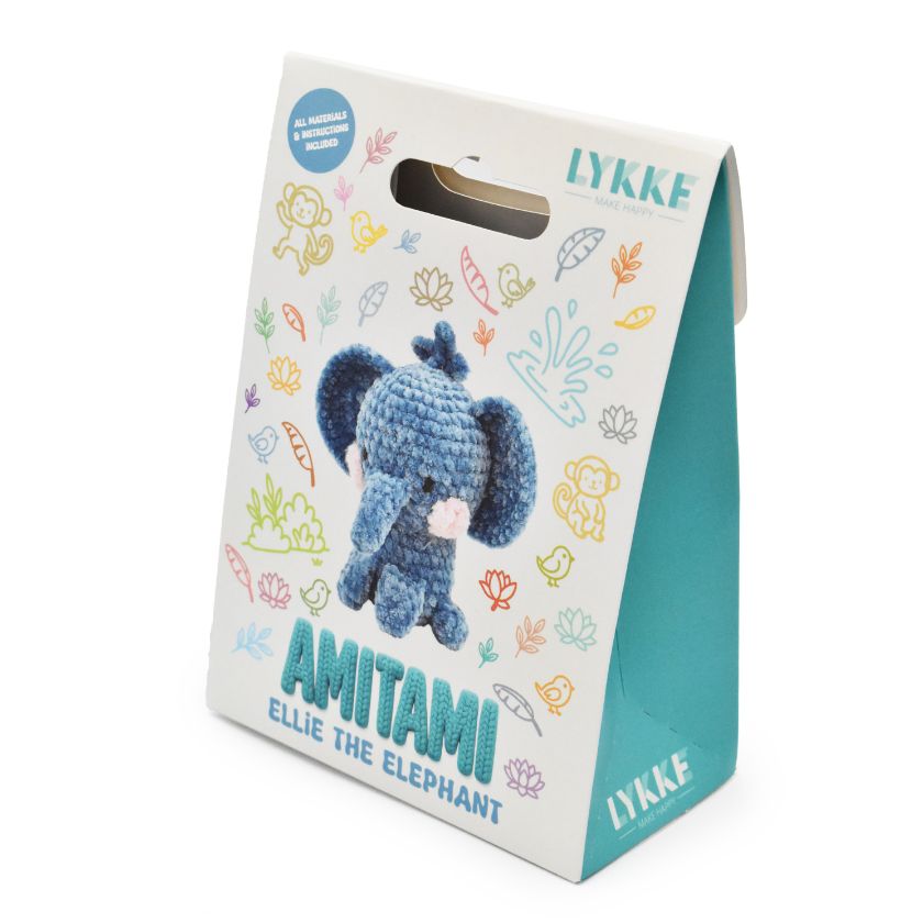 Packaging of an Amitami elephant knitting kit with 'LYKKE' branding on a white background