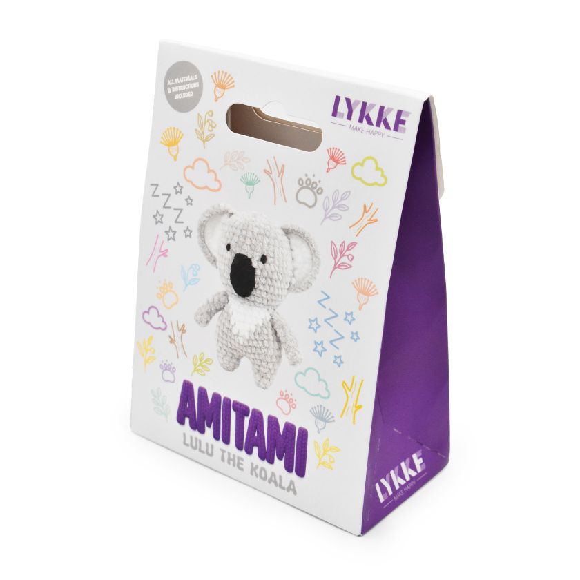 Packaging of an Amitami koala knitting kit with 'LYKKE' branding on a white background