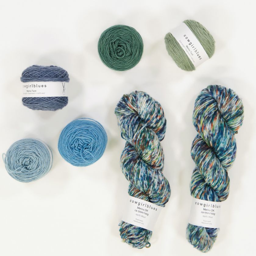 A collage of the yarn used in the blues and green Beehive Baby blanket by cowgirlblues