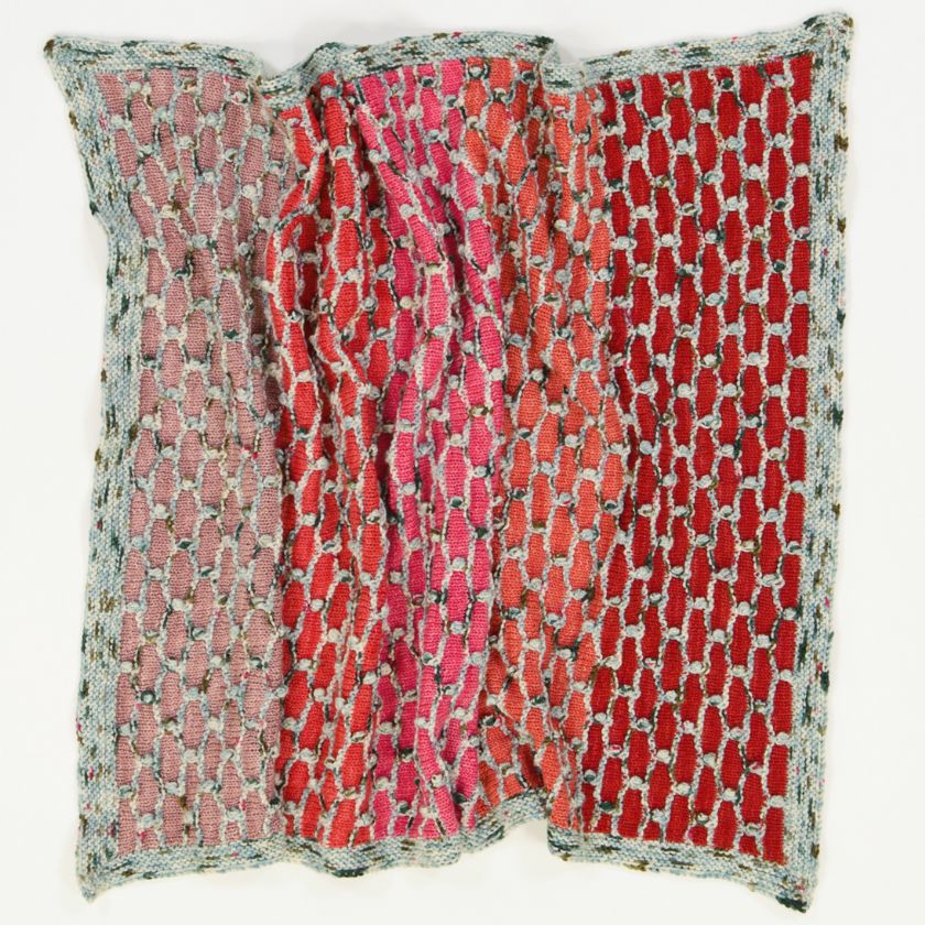 A completed Beehive baby blanket in inks and red by cowgirlblues