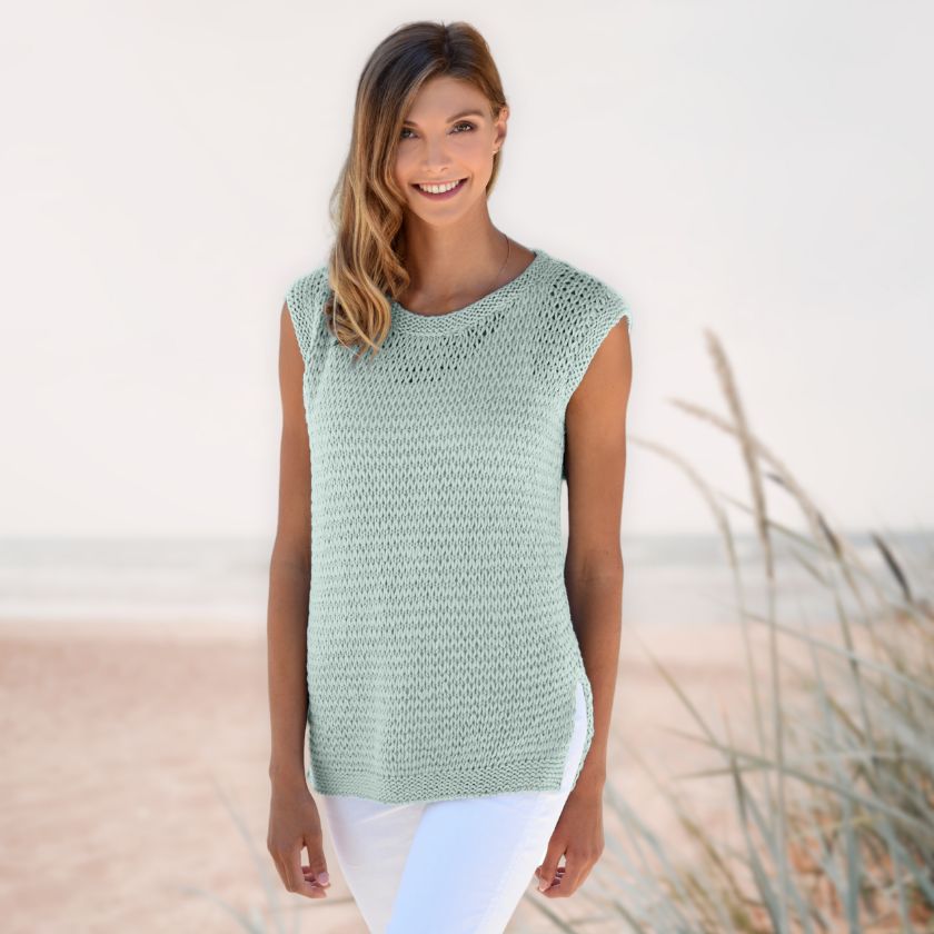 Model wearing the Dorothea Tank from the Dizzy Knitter in celadon
