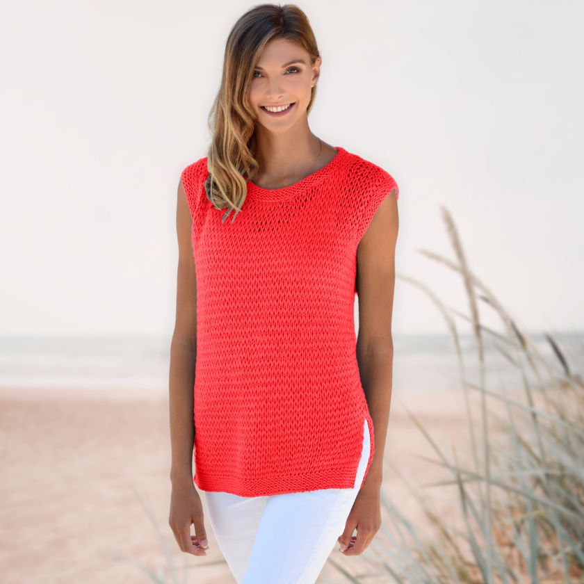 Model wearing the Dorothea Tank from the Dizzy Knitter in poppy