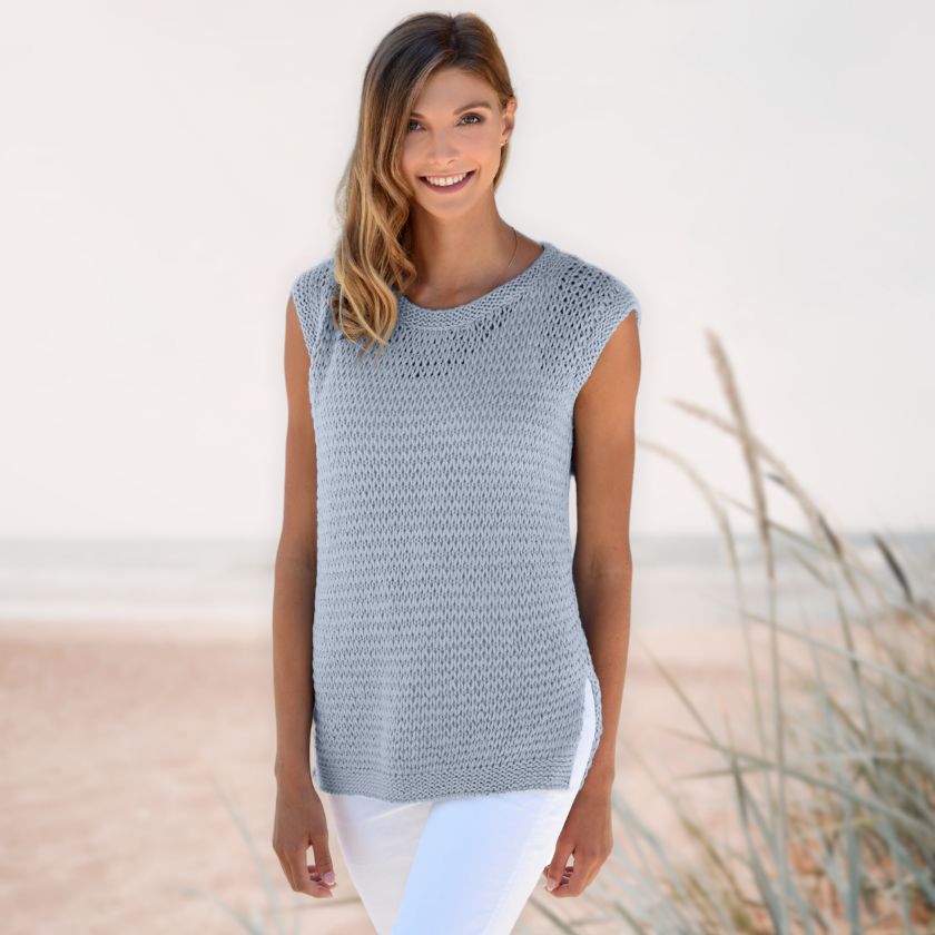 Model wearing the Dorothea Tank from the Dizzy Knitter in stone