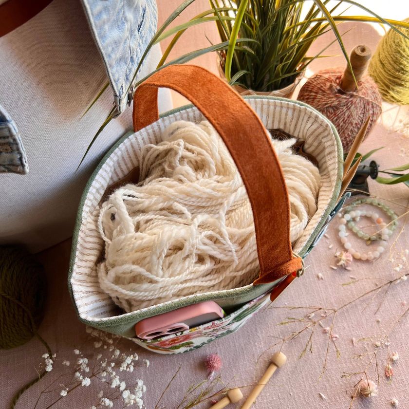 The Florence Caddy by Atenti Bags filled with white yarn