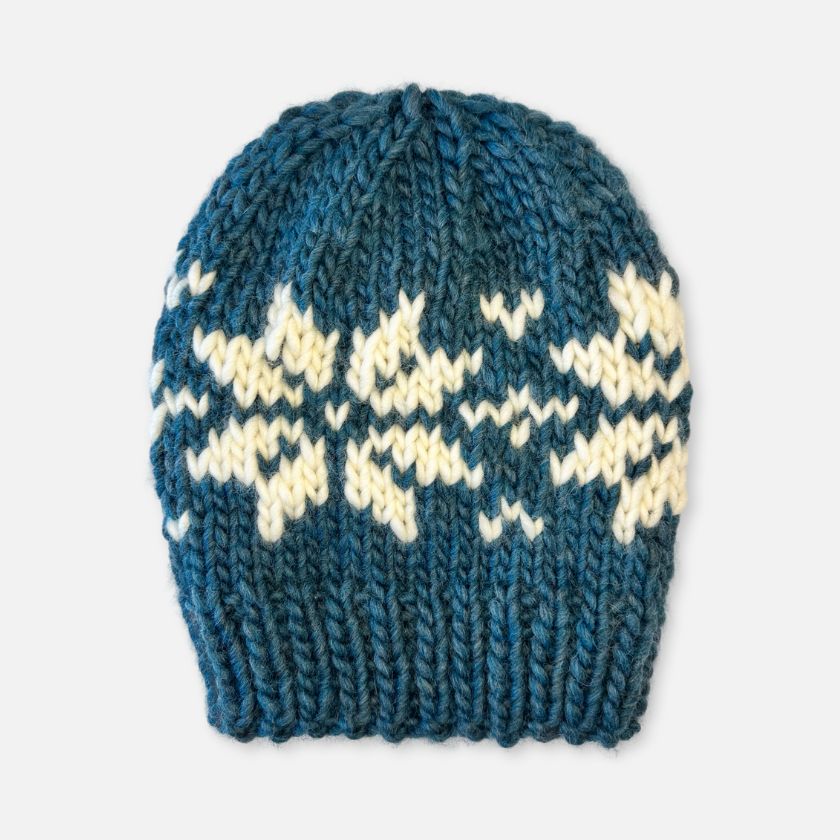 A green and white striped Frosty North & Loom colored beanie hat.