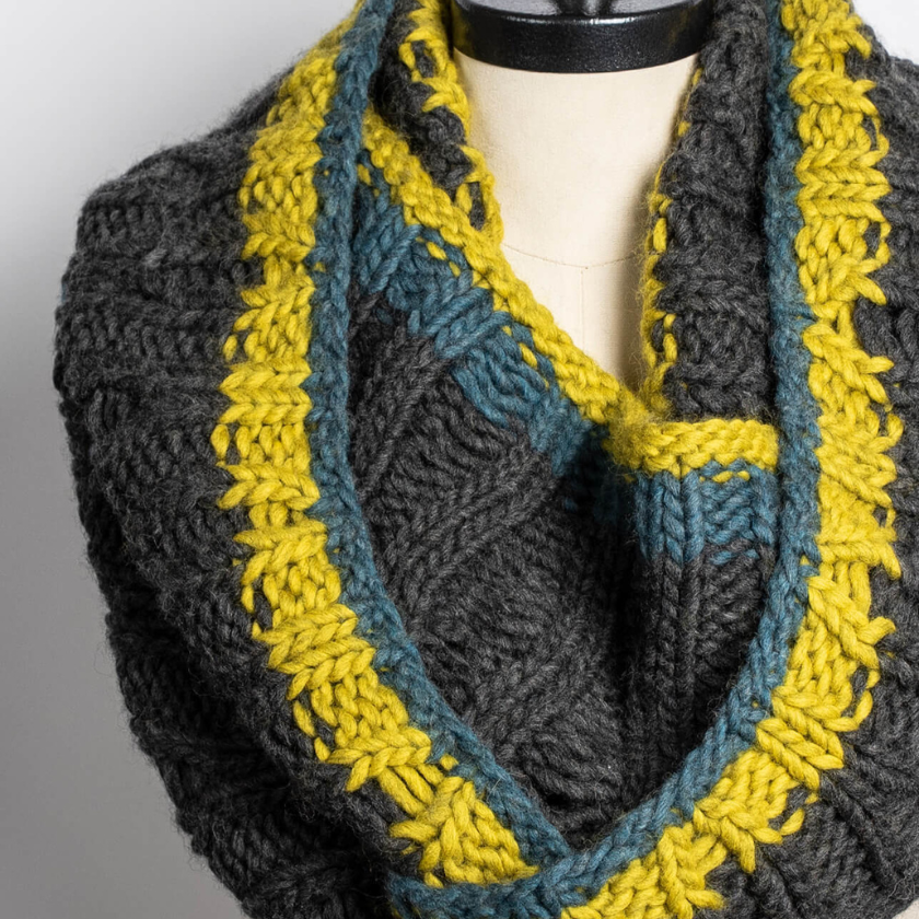 Close-up of Glacier Cowl on mannequin highlighting sculptural ribbing and colorwork detail knit with Woolstok North super bulky yarn
