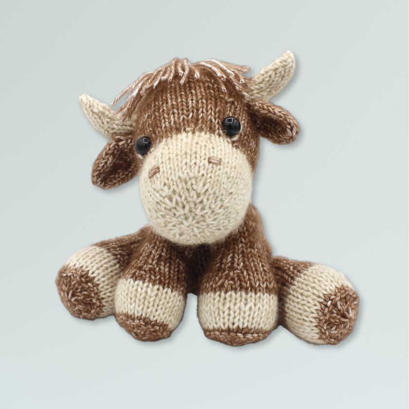 Amigurumi knitting kit of a cow from the Dizzy Knitter