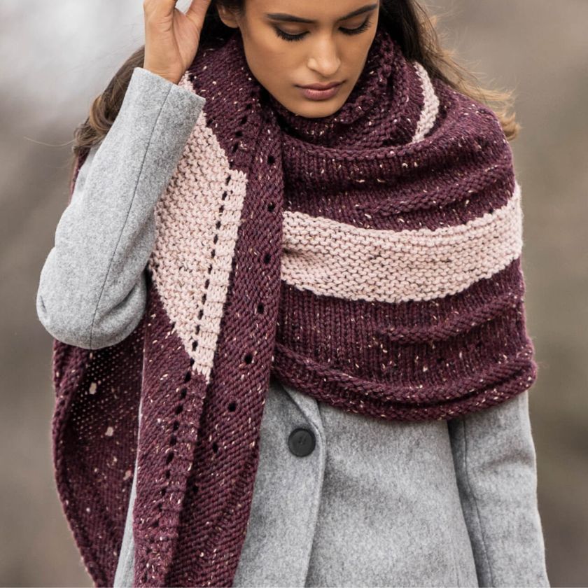 Close-up of the Kelso Wrap showing textured stitch pattern, eyelet details, and contrasting stripe placement.