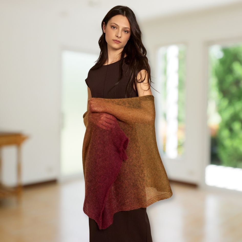 Woman wearing a multicolored Laine Dunord Poema Mohair wrap against a beige background