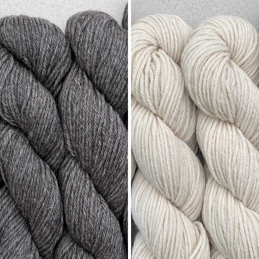 Skeins of yarn for the Milano Sweater knitting pattern in Ecru and Anthracite