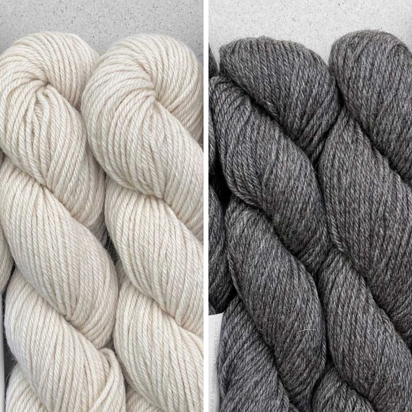 Skeins of yarn for the Milano Pullover knitting pattern from the Dizzy Knitter in Ecru and Anthracite