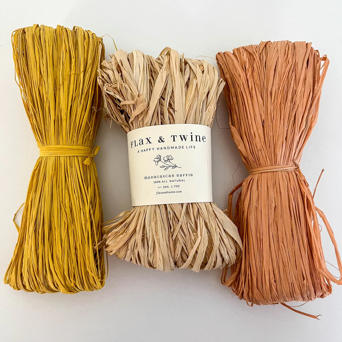 Three bundles of flax fibers with a 'Flax & Twine' label on a white background