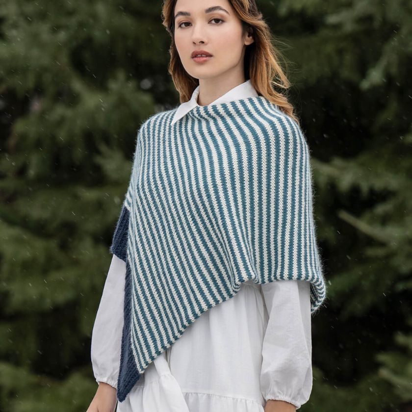 Woman wearing a blue and white striped Bianca Wrap in a forest setting