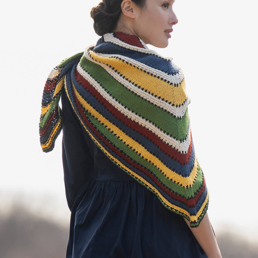 Back view of the Camp Ivanhoe Shawl Kit showing the triangular shape and colorful striped design.