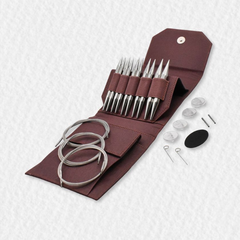 Set of bulky Lykke Flight knitting needles in a maroon case on a white background