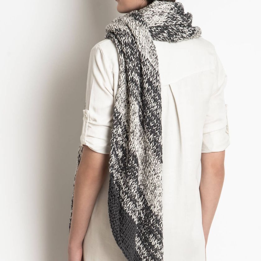 Side view of a model wearing the Worthington Wrap from The Dizzy Knitter