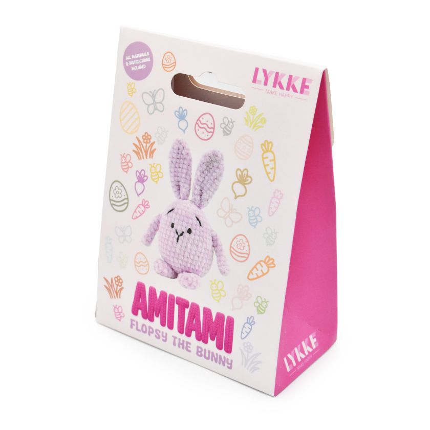 Packaging of an Amitami bunny rabbit knitting kit with 'LYKKE' branding on a white background
