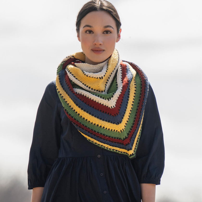 Camp Ivanhoe Shawl Kit worn as a striped cotton wrap with bold cabin blanket-inspired colors.