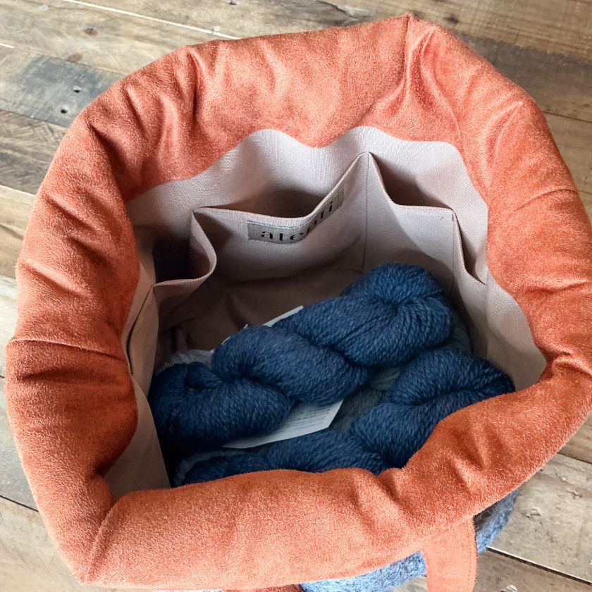 Interior of the Charlie Bag from Atenti bags holding multiple skeins of yarn