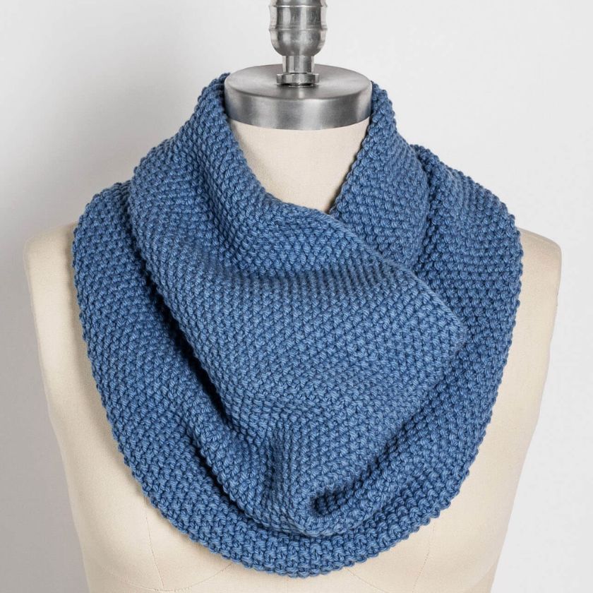 Beginner seed stitch cowl knitting kit in blue wool cotton yarn, finished Columbia Cowl displayed on mannequin