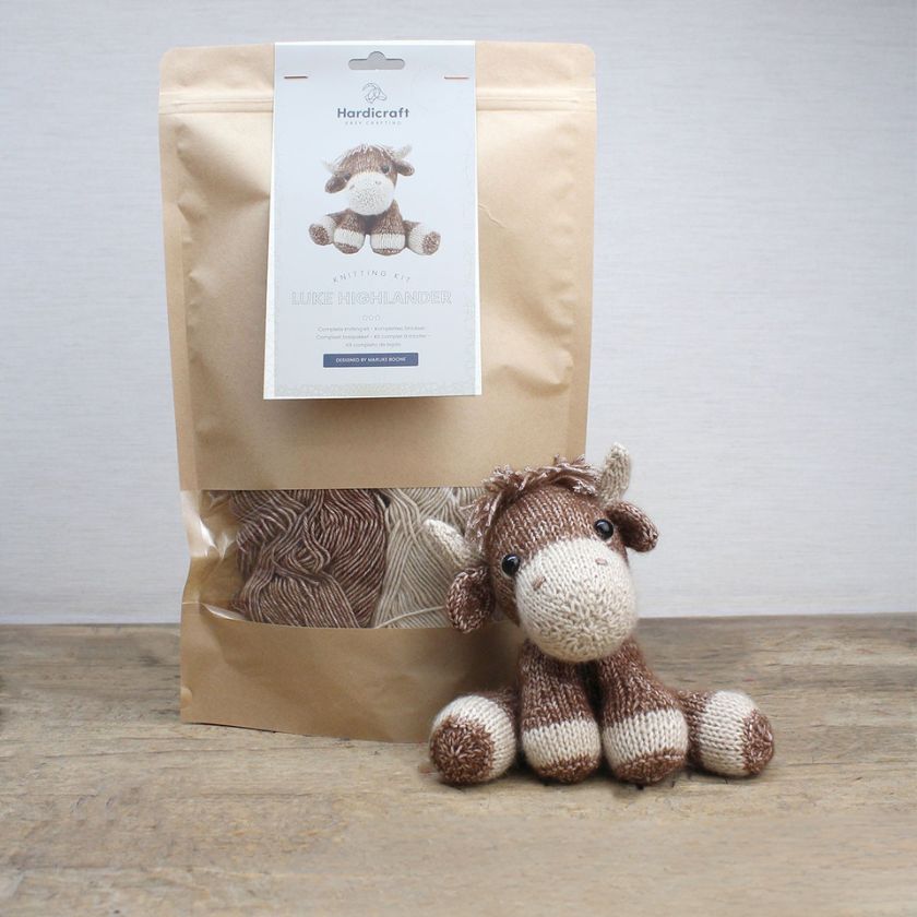 Amigurumi knitting kit and completed cow