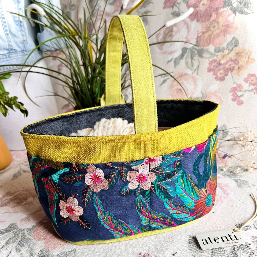 Colorful embroidered knitting project bag by Atenti with floral patterns with a floral background