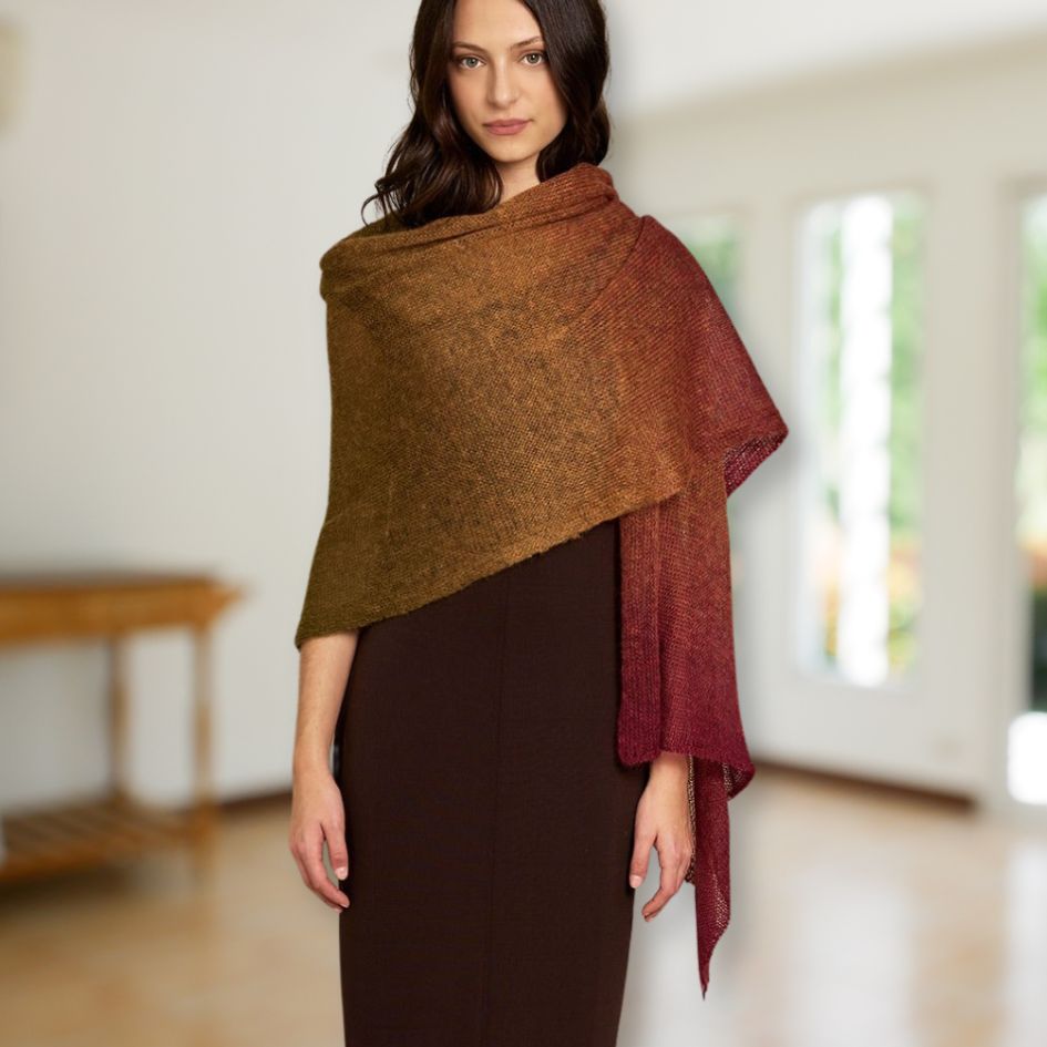 Woman wearing a multicolored Laine Dunord Poema Mohair wrap in a light room