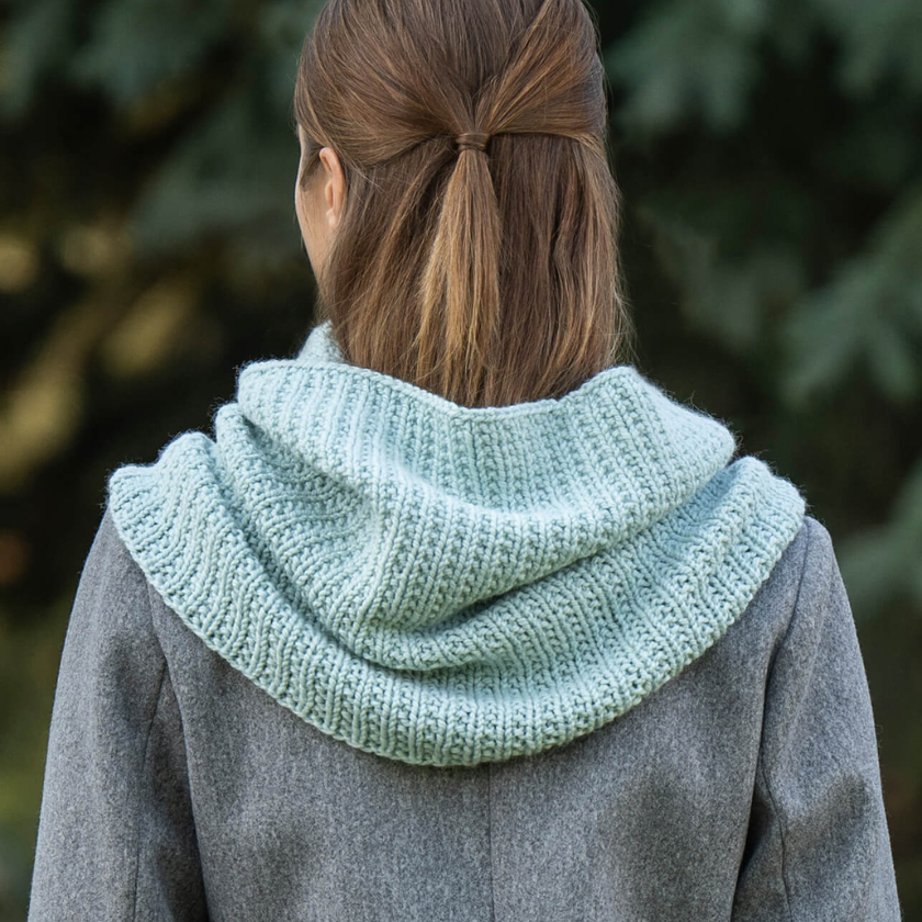 Mist Cowl knit in Blue Sky Fibers Extra Aran shown from the back highlighting generous coverage and cozy folded fabric, The Dizzy Knitter