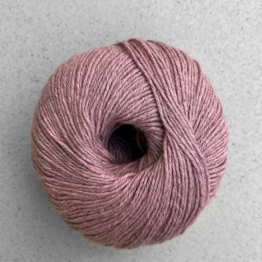 A ball of Rose Puno yarn by Pascuali used in the Kiara tee kit from the Dizzy Knitter