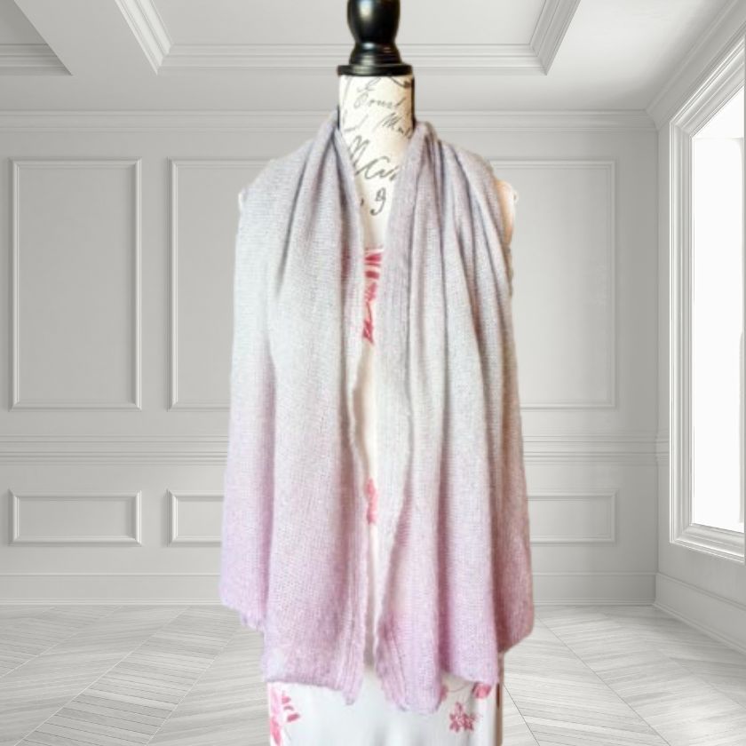 Mannequin wearing a light purple and pink Poema Wrap with a white background