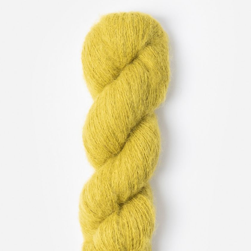 Yellow skein of Prairie yarn by Blue Sky Fibers on a white background
